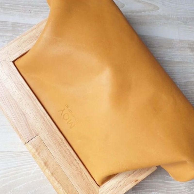 saffron yellow timber clutch showing plain back