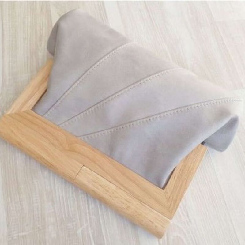 Stone grey leather clutch with timber handle