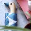 Original Duckhead umbrella denim moon on counter closeup of wooden duckhead with blue beak