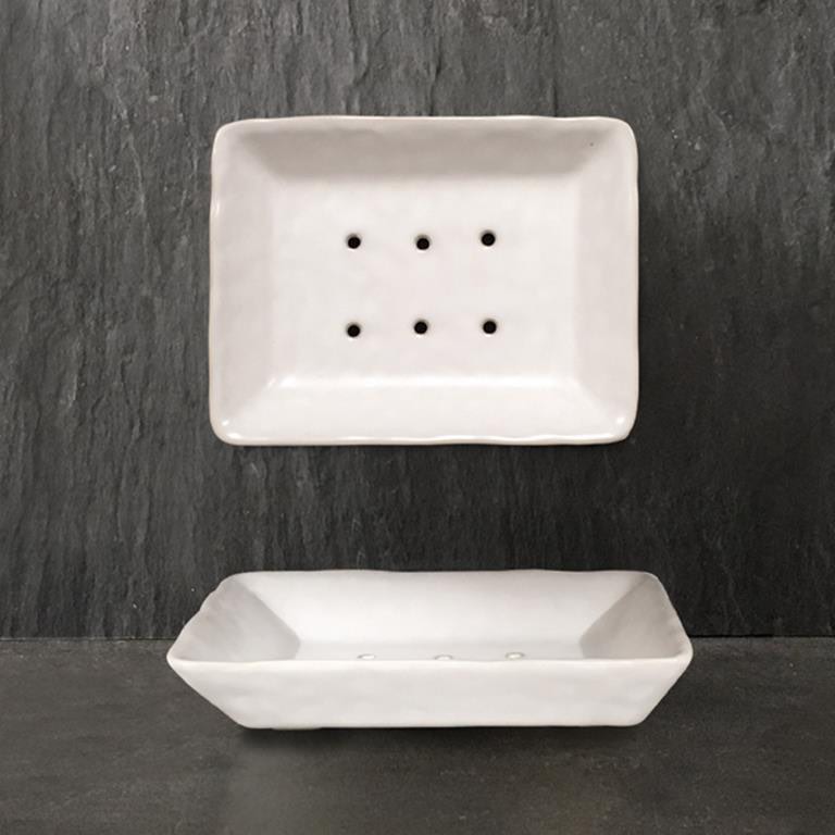 white porcelain footed soap dish from East of India with six drainage holes