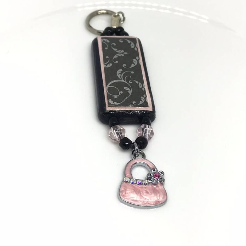 phone or bag charm black and pink bag charm with pink purse charm hanging from bottom
