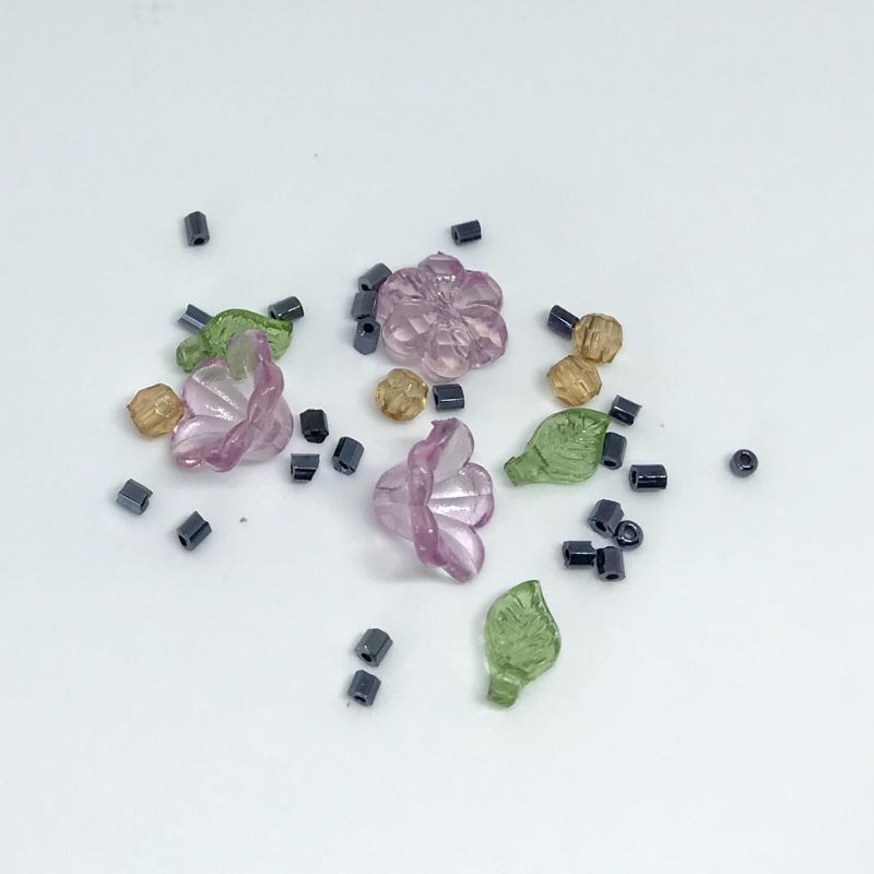 bead pack, pink flower shapes, green leaves with brown beads and black seed beads