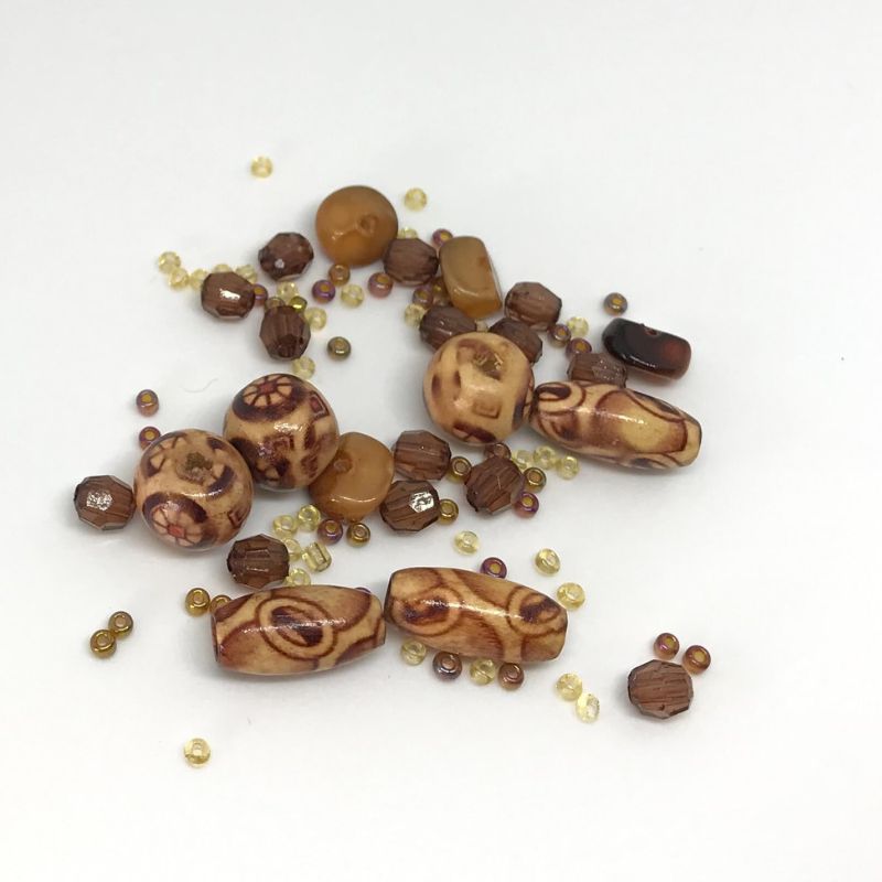bead pack with painted beads and brown taupe and tortoise shell beads and light and clear seed beads