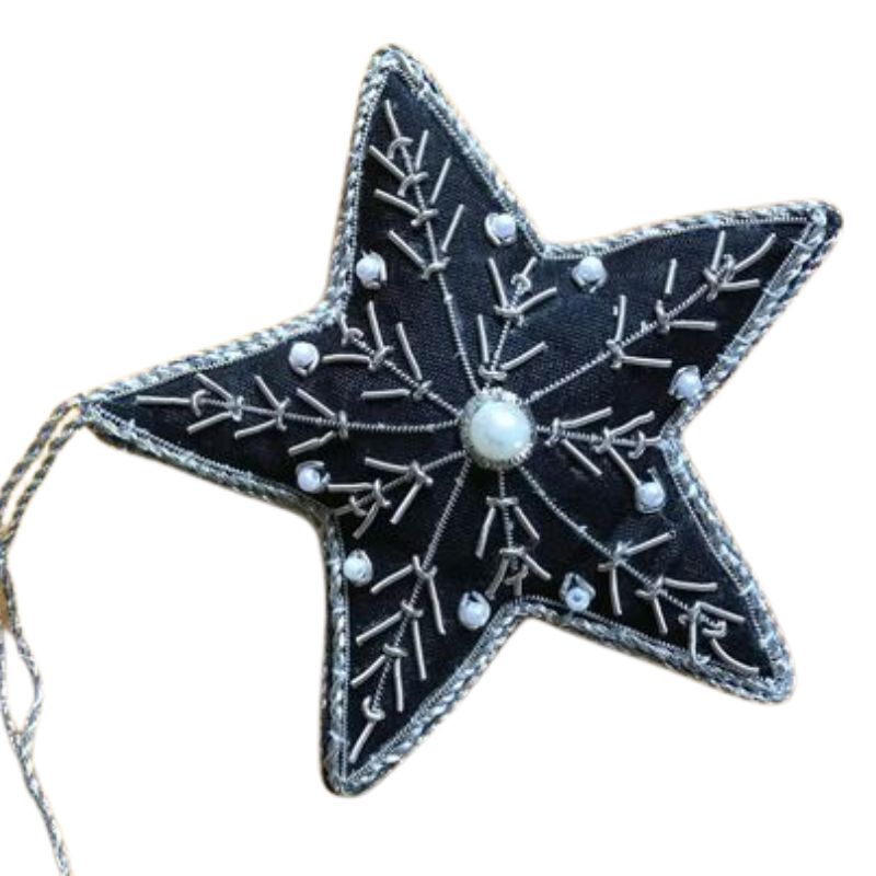 a black star with beads and embroidery