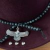 wool felt fedora in a berry colour with beads and eagle charm
