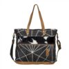 messenger bag with geometric black and white canvas with black and white hair on leather strip