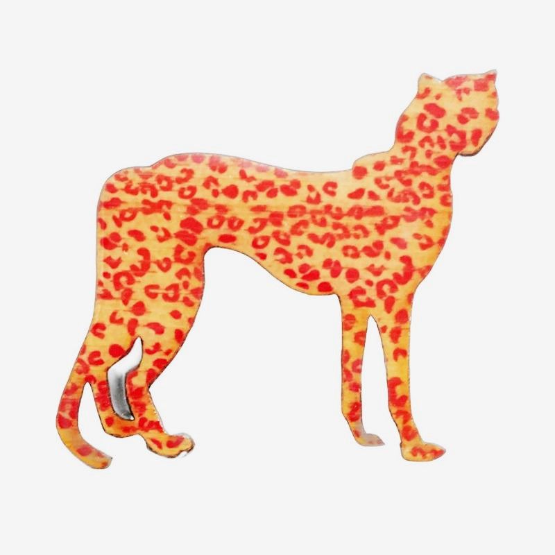 Cheetah design brooch with red spots and tan background