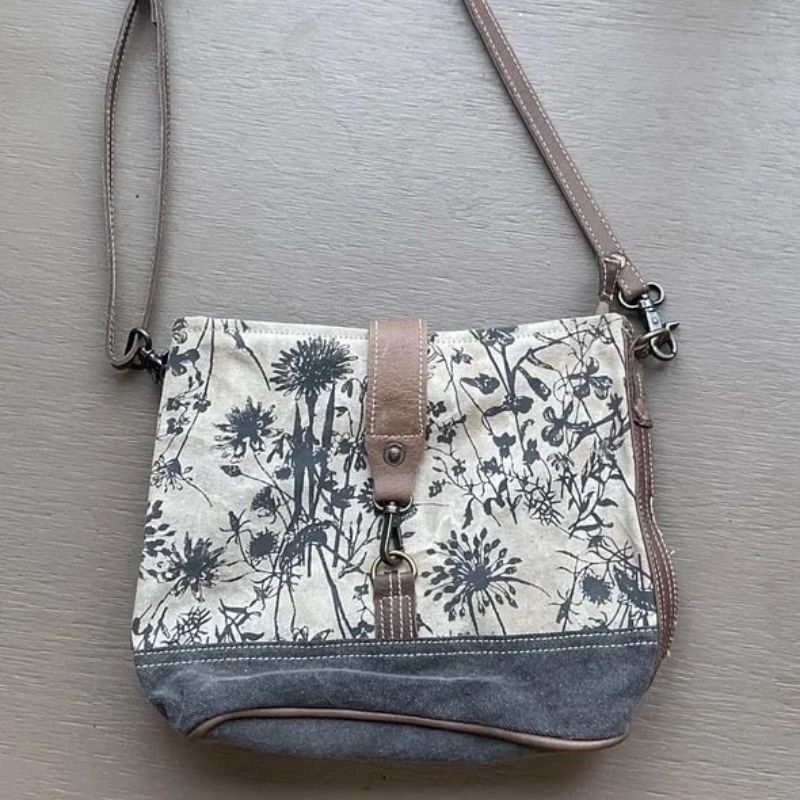 flower pattern canvas bag with strap and front lock and coordinating canvas bottom
