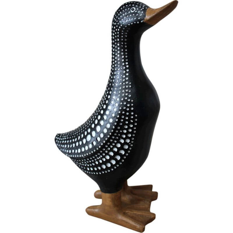 resin duck home decoration with black background and white spots