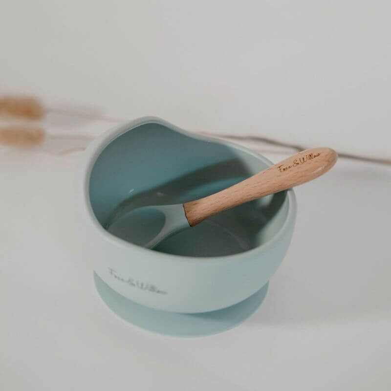 silicone baby feeding bowl with wooden and silicone spoon dusty blue tones