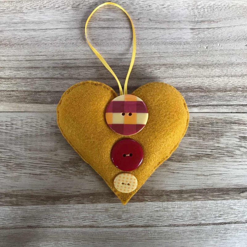 felt heart decoration ornament mustard yellow with red and mustard buttons