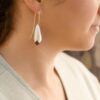 lady wearing earrings australian timber flower bud with sterling silver petals