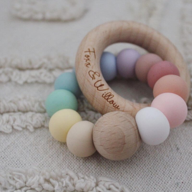 infinity teething rattle wood with silicone beads pastel rainbow colours