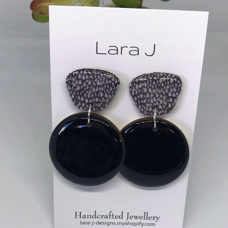 black glossy drop earrings with coordinating dark lavender spotted top