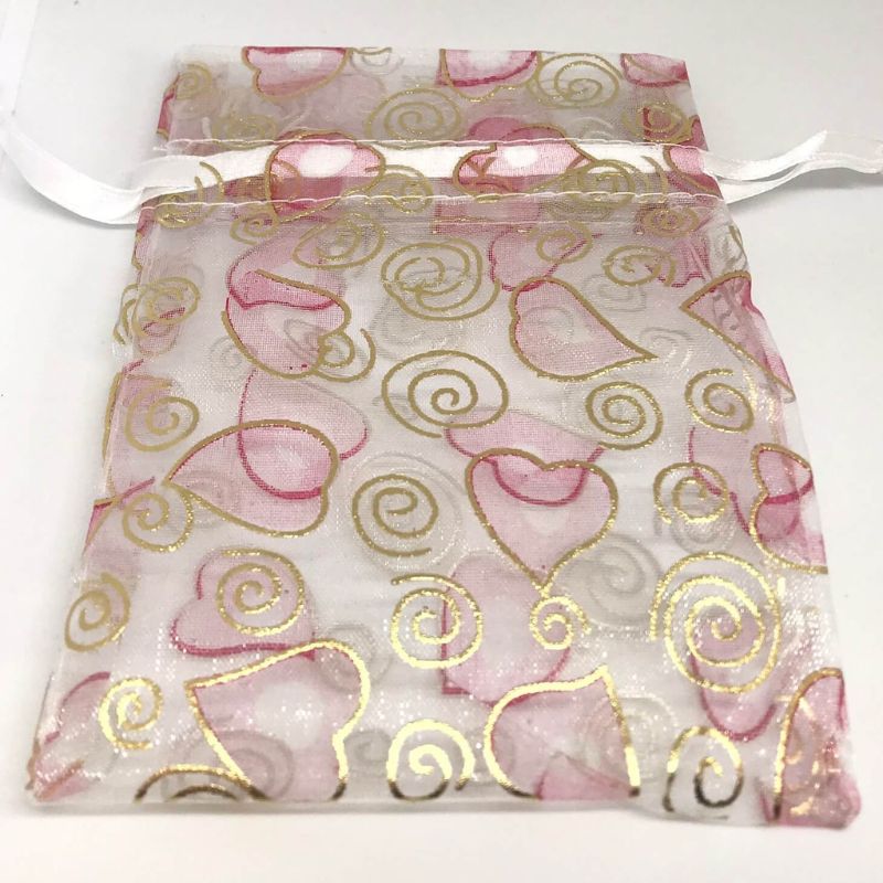 organza bag with hearts and swirls patterns