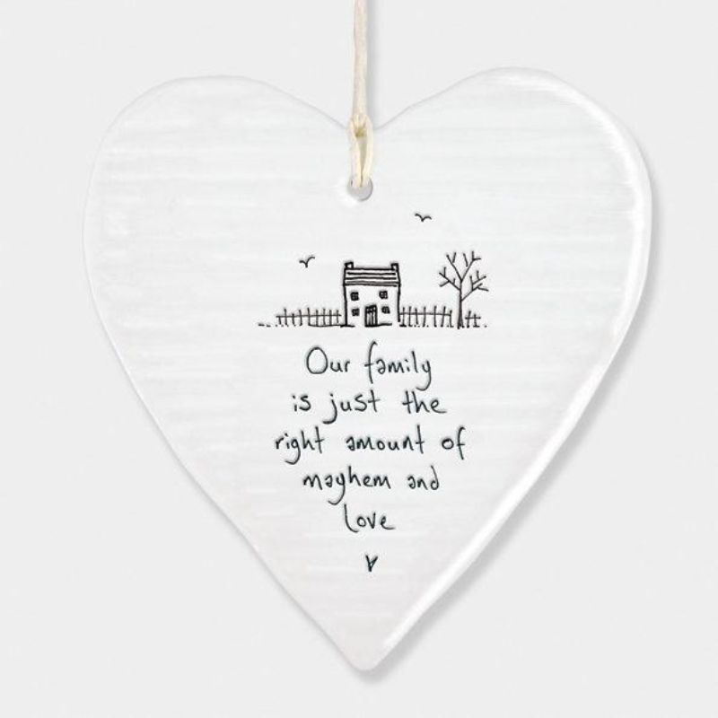 white porcelain hanging heart east of india, saying our family is just the right amount of mayhem and love