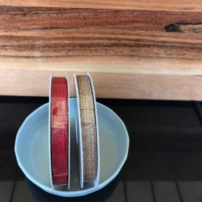 Polyester ribbon 8mm one tan and one red.