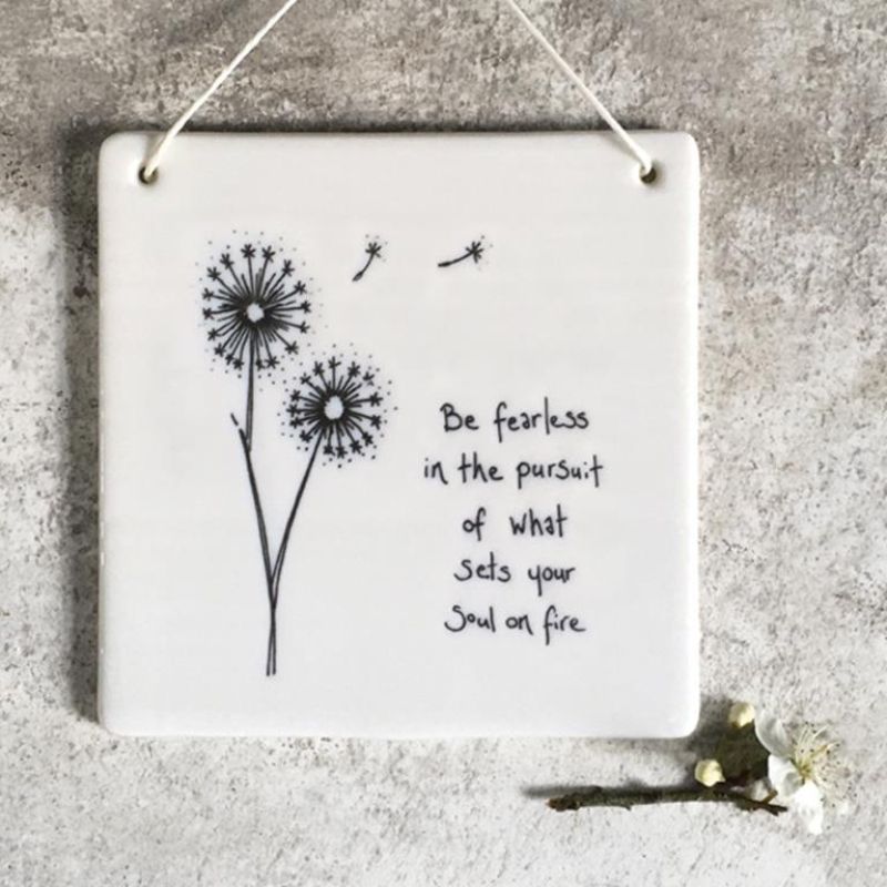 white porcelain square plaque with dandelion and saying be fearless in the pursuit of what sets your soul on fire