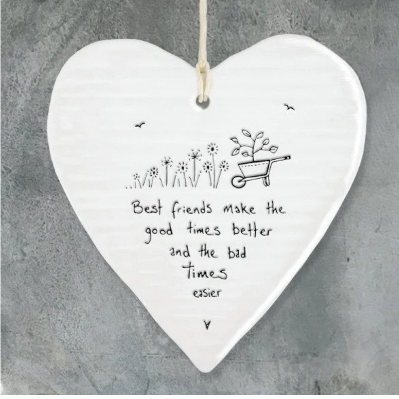 white porcelain hanging heart with the saying best friends make the good times better and the bad times easier