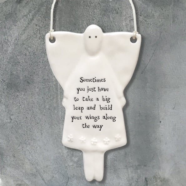 white porcelain Angel ornament, sometimes you just have to take a big leap and build your wings along the way