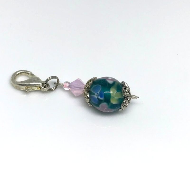 phone bag or zip dangle blue lampwork bead covered in flowers with pink Swarovski bicone accent bead