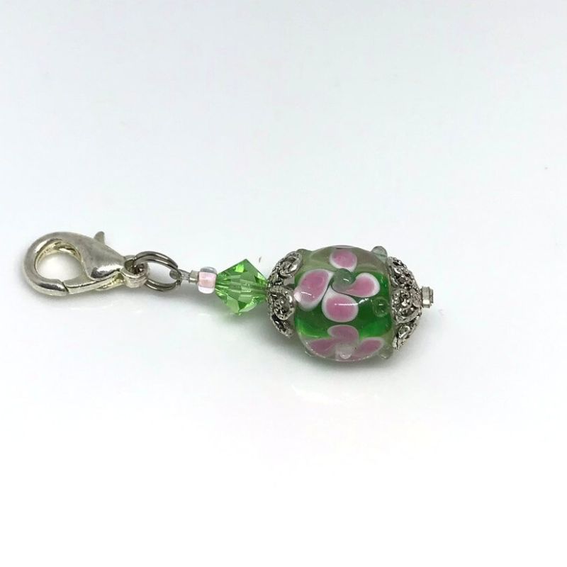 phone bag or zip dangle green lampwork bead covered in flowers with green Swarovski bicone bead accent