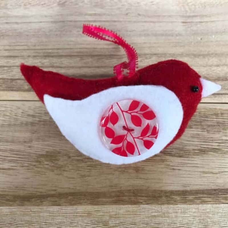 felt bird ornament with white wing and red leaf accent button