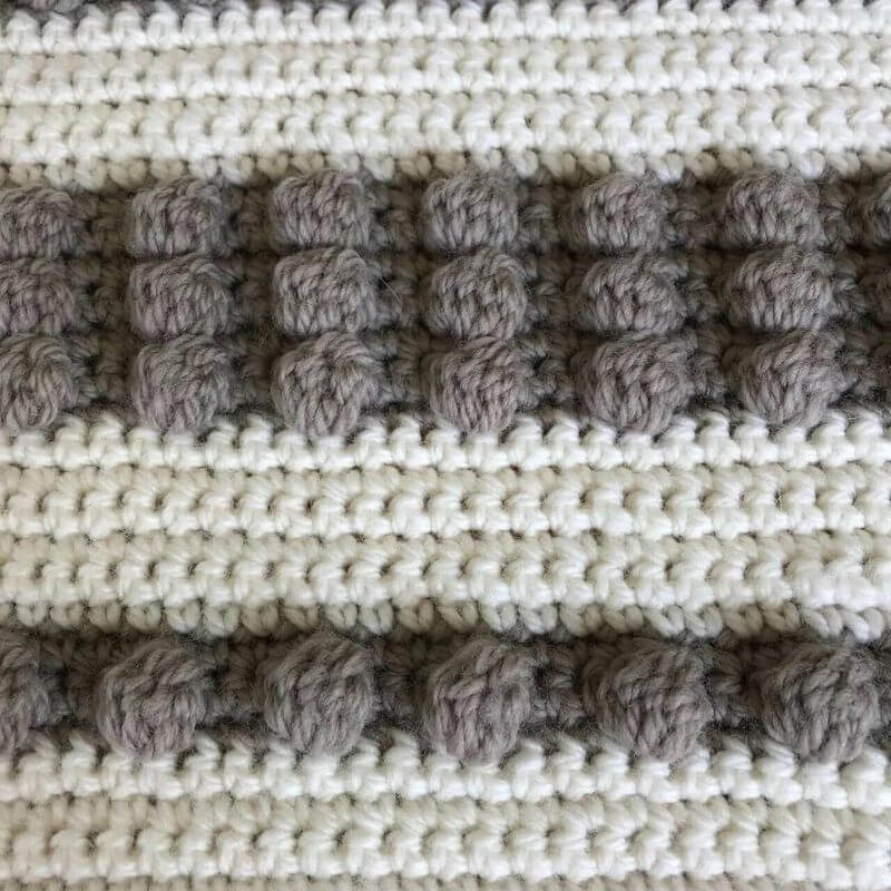 baby 100% wool pram or car seat blanket showing closeup of the bobble pattern