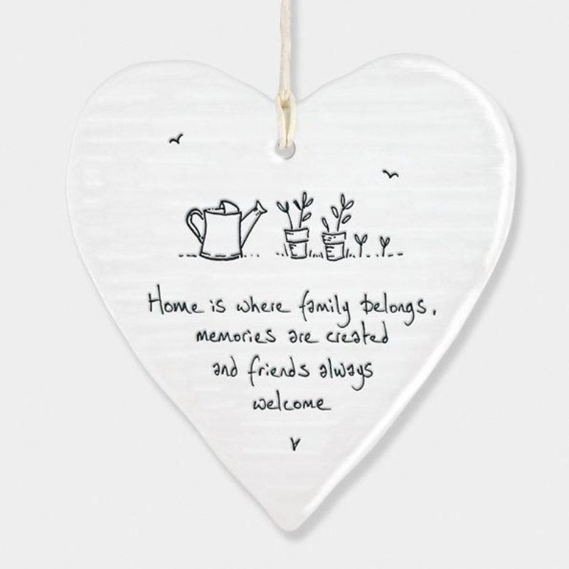 white porcelain hanging heart east of india, saying home is where family belongs memories are created and friends always welcome