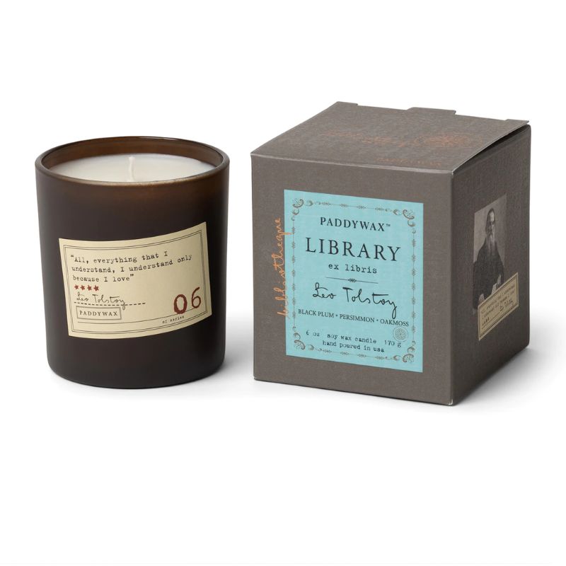 paddywax library series candle leo tolstoy in brown container with quote on the side