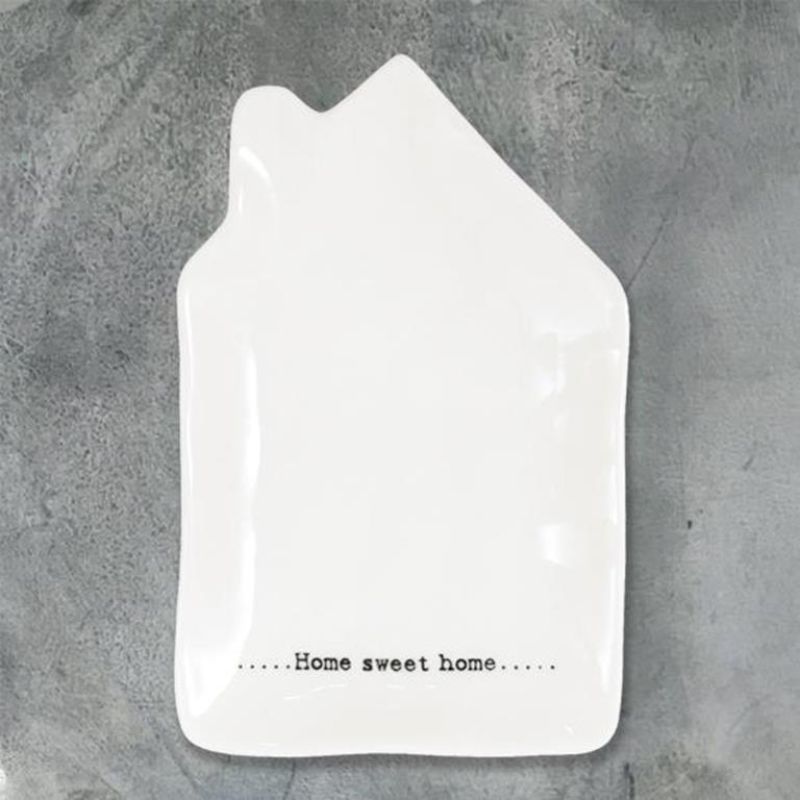 white porcelain dish shaped like a house with home sweet home words on the bottom