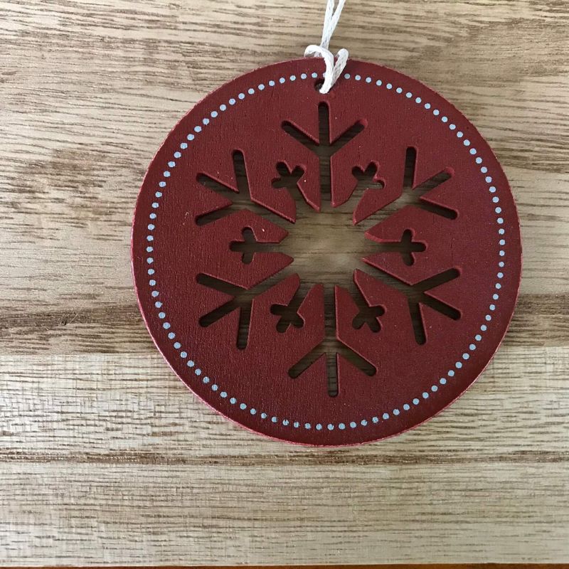 round red tag ornament with snowflake cutout