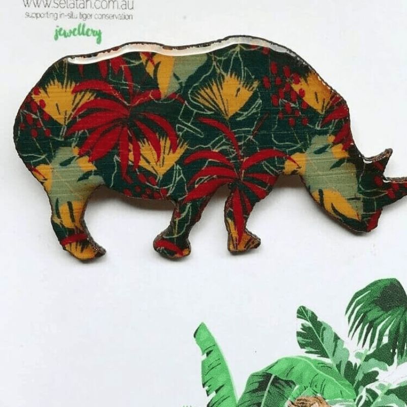 rhino brooch with red leaves and flowers