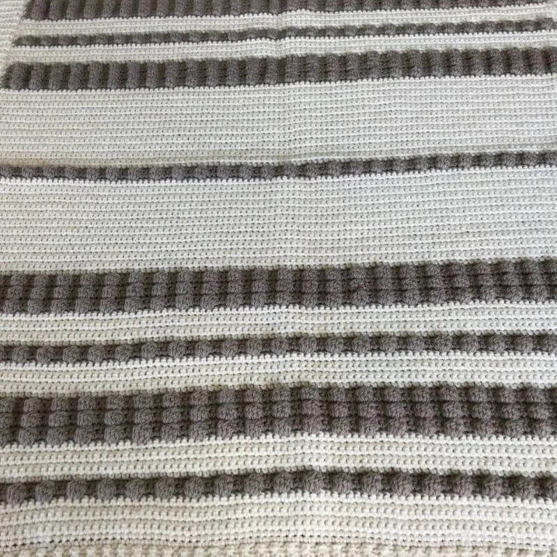 100% wool baby blanket pram car seat size showing strips of bobble pattern and plain crochet