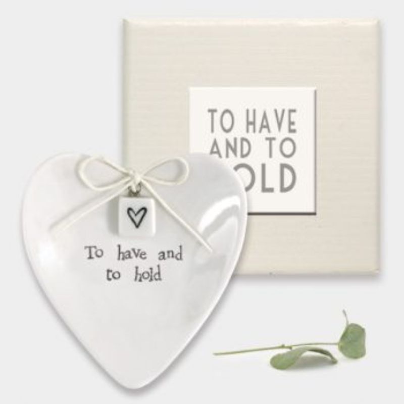 white porcelain marriage heart shaped dish with the words to have and to hold and a heart token