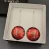 Dangle earrings with picture of waratah transferred to aluminium erin.k jewellery boxed