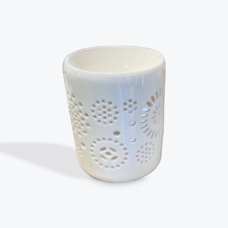 white tealight oil burner with circle cutout design