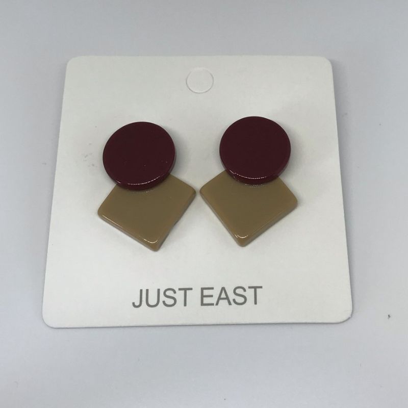 Resin stud earrings with a burgundy circle and offset tan square underneath